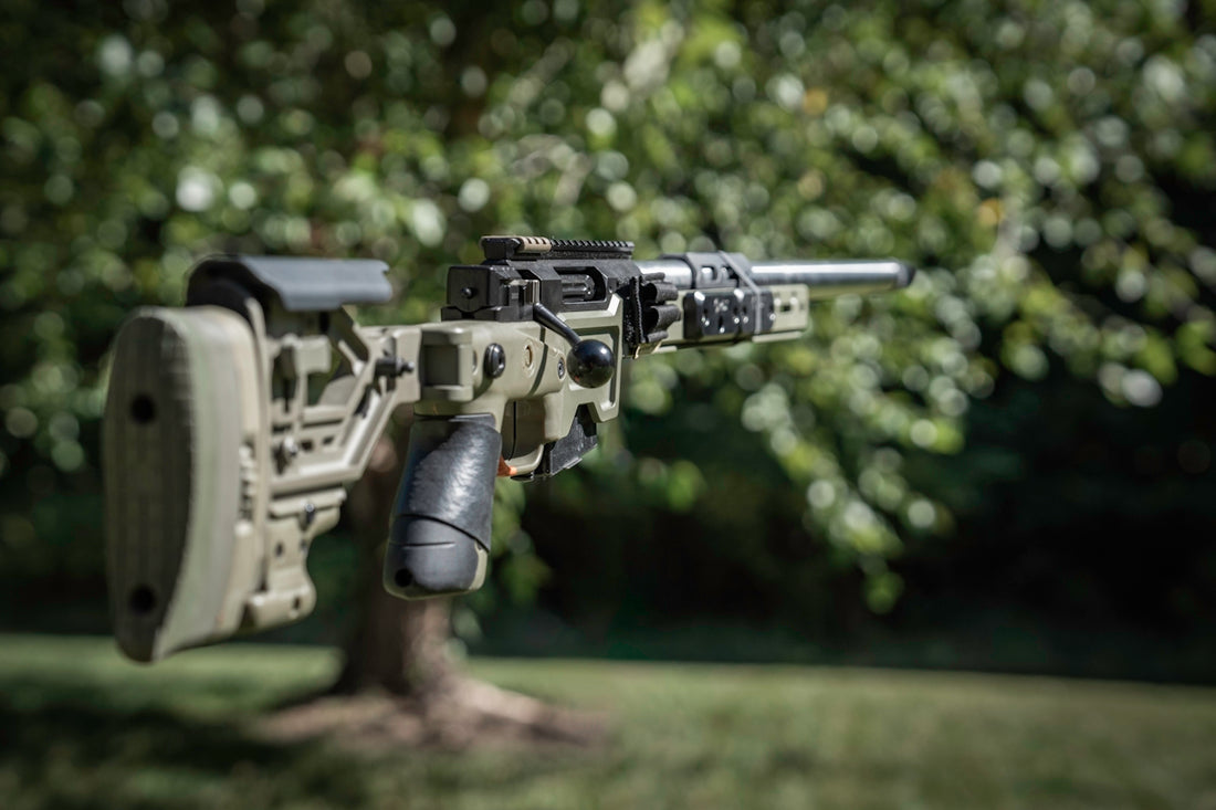 A close up of a rifle on a tree